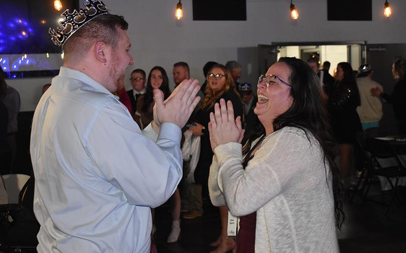 Jon Marsteller and Renee Roberts share a smile on the dance floor at A Night to Shine on Friday night at Level Grove Baptist Church. MATTHEW OSBORNE/Staff