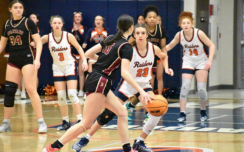 Habersham Central’s Kyia Barrett, Mackenzie Gosnell (3) and Daytona Underwood (14) are locked in on defense against South Paulding on Tuesday night. MATTHEW OSBORNE/Staff