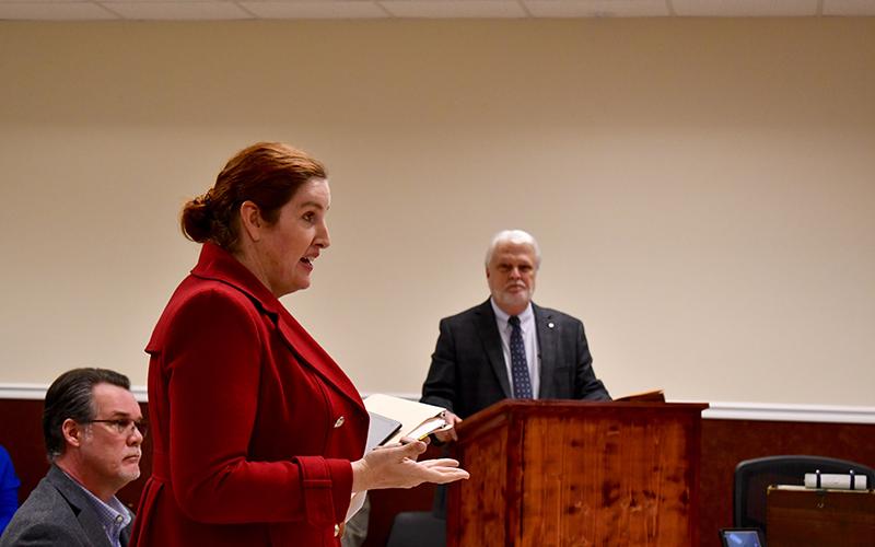 Vertical Bridge attorney Mattaniah Jahn (front) rebuts a point made by Ralph Taylor who represents the county with Hunt &amp; Taylor Law Group. JULIANNE AKERS/Staff