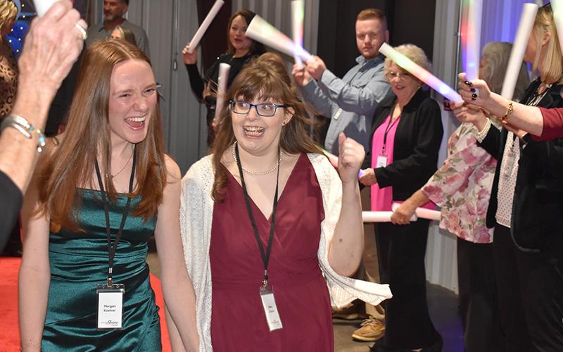 Morgan Kastner and Riley Clarke walk the red carpet on their way into the dance hall. MATTHEW OSBORNE/Staff