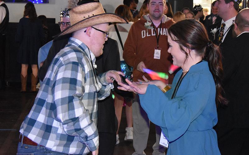 Nathan Anderson and Ashley Howe smile after a song they like comes on at the Night to Shine prom event at Level Grove Baptist Church, sponsored by the Tim Tebow Foundation. MATTHEW OSBORNE/Staff