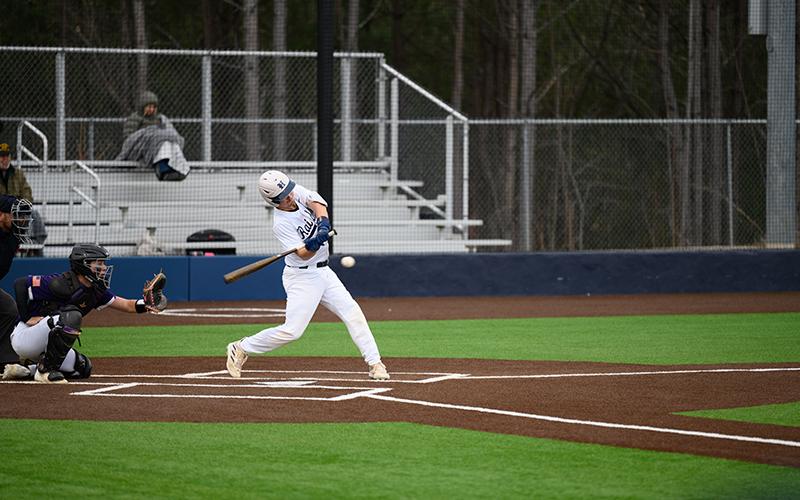 Raiders catcher Spencer Frady fights off a fastball with two outs. ZACH TAYLOR/Special