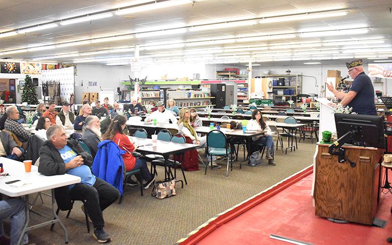VFW Commander Bill Miles addresses the crowd at a town hall meeting Friday night in Cornelia. MATTHEW OSBORNE/Staff