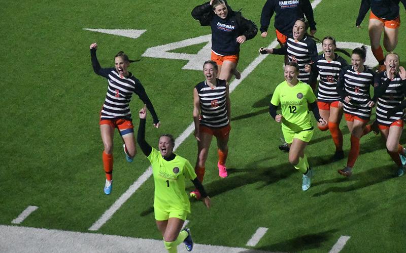 Habersham Central’s girls soccer team runs to the stands to acknowledge the crowd that sat through 100 minutes of rain and wind to watch them earn a program-altering 2-1 win over Jackson County on Friday. Scan above for Tuesday’s match results. MATTHEW OSBORNE/Staff