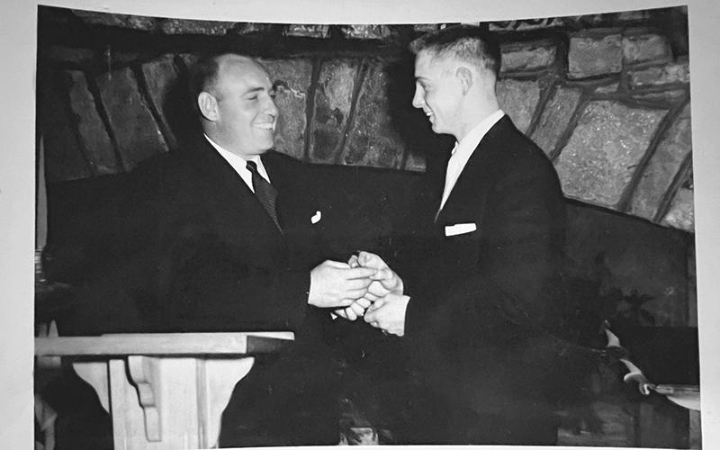 Coach Gene Alexander  hands Herman Benfield his All-Region award during a banquet  following the season. SUBMITTED
