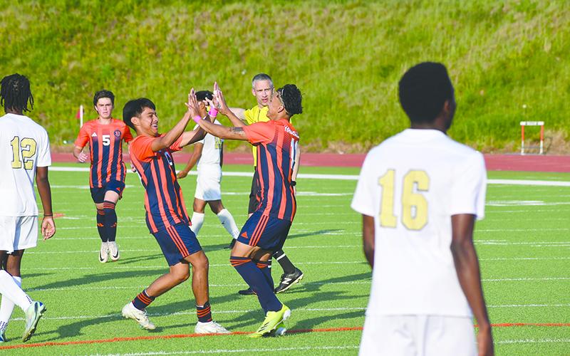 Habersham Central’s Juan Lara (left) and Xzavier Lopez celebrate a goal against Douglas County. LANG STOREY/Staff
