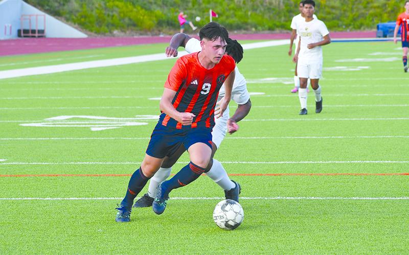 Habersham Central’s Angel Vallejo beats a defender to the ball during the Raiders’ win over Douglas County on Friday. LANG STOREY/Staff