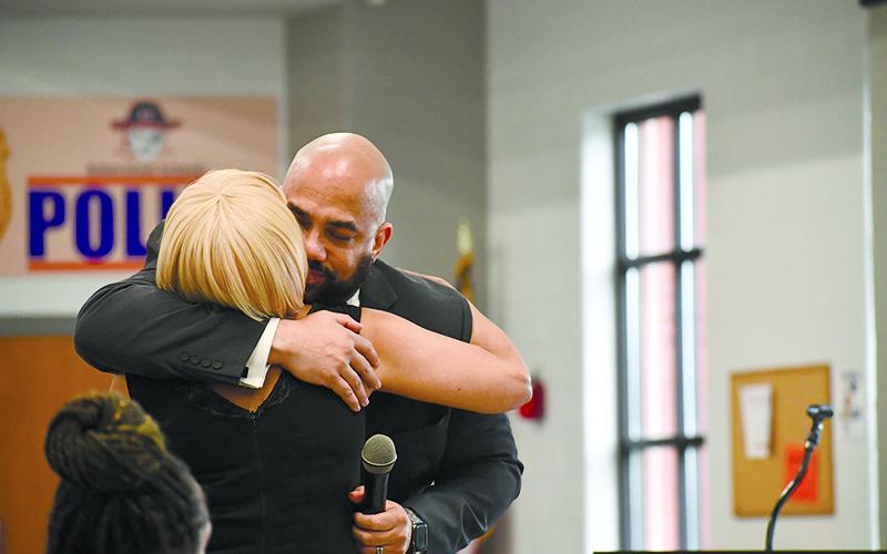Dr. Aaron Scott and his mother, Sheree Parrish, of Cornelia, embrace at the 2024 Lifetime Achievement Award ceremony. JULIANNE AKERS/Staff