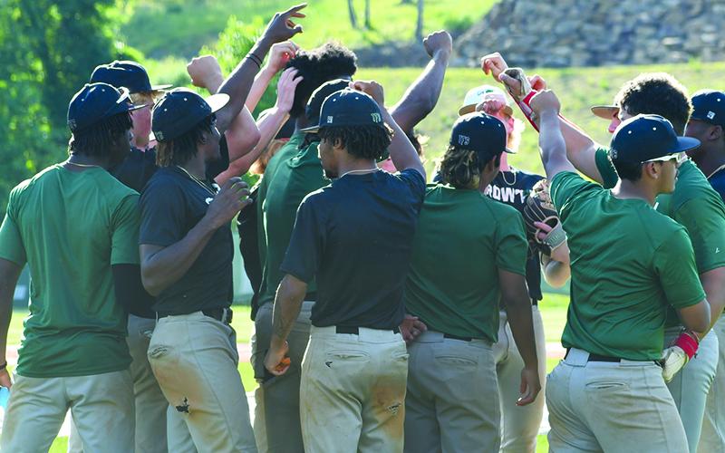 The TFS baseball team huddles up at the end of practice Wednesday. LANG STOREY/Staff