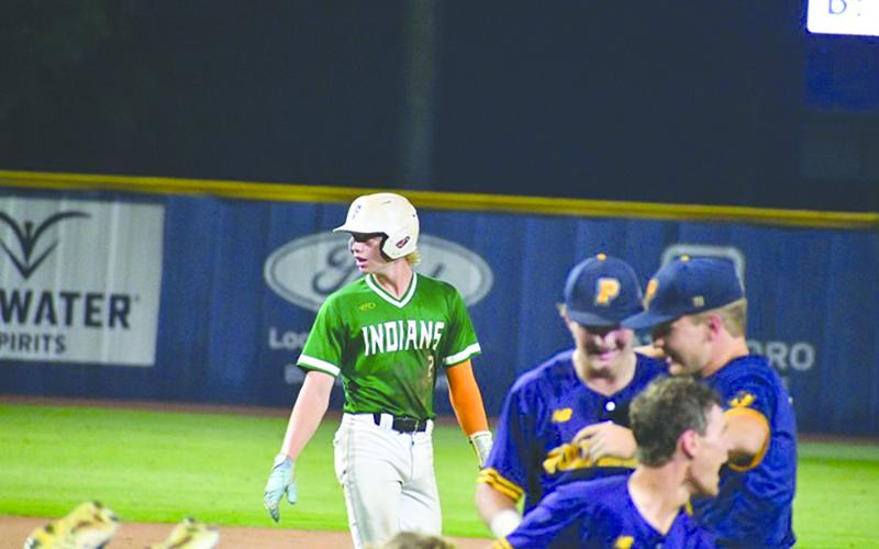 Chase Pollock walks off after the final out as the Wolverines  celebrate. WADE CHEEK/CNI News Service