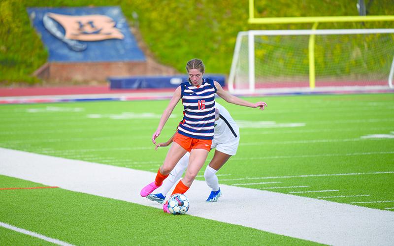 Abigail Hotard flicks the ball upfield to Meg LaBarbera. ZACH TAYLOR/Special