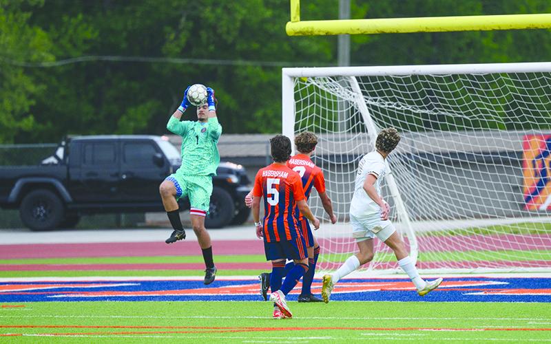 Raider goalie Everett Rudeseal leaps to snag a ball that zipped toward the net. ZACH TAYLOR/Special
