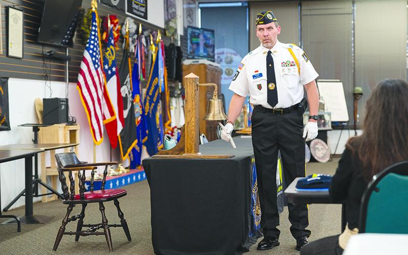 Jim Morgan rings the bell after each war is named, along with the number of KIA and  non-combat deaths. ZACH TAYLOR/Special