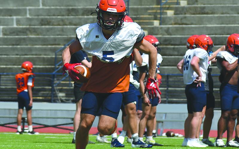 Zeke Whttington turns upfield after securing a pass at practice Wednesday.