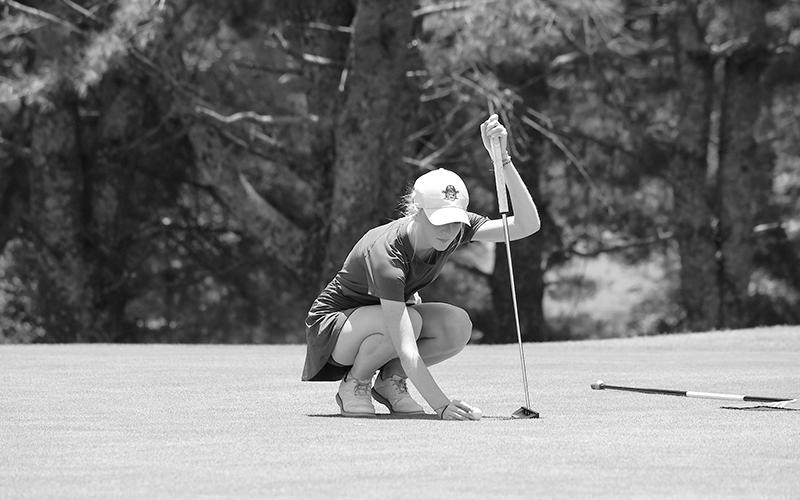 Addie Maney lines up a putt during Round 1 at Apple Mountain. LANG STOREY/Staff