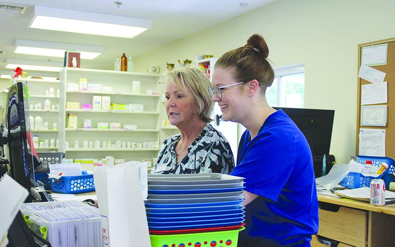 Habersham Drug co-owners Deborah and Hannah Gale work to check prescriptions. BRIAN WELLMEIER/Special