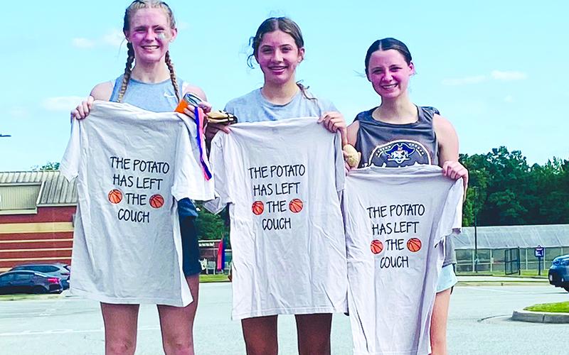 Top 3 finishers (from left) Tessa Murdock, Sadie Chambers and Mackenzie Gosnell show off their 5K T-shirts. SUBMITTED