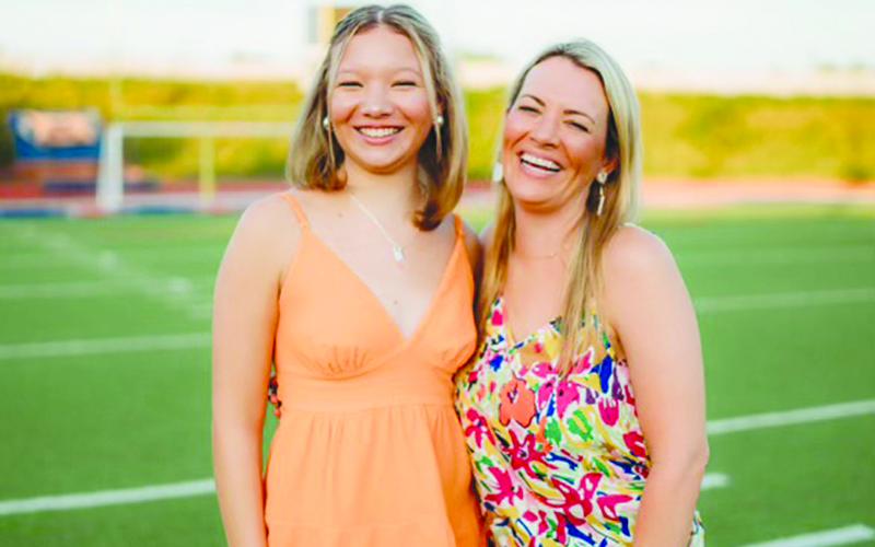 Habersham Central Senior Kali Contreras, left, and her mother Brittany smile big in a photo at Raider Stadium. SUBMITTED