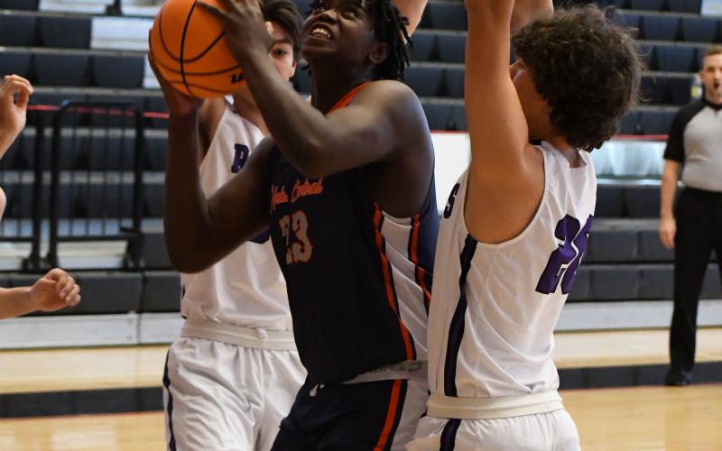osiah McCurry gets surrounded by defenders during a game last year. He will get plenty of attention from colleges during his senior year. FILE