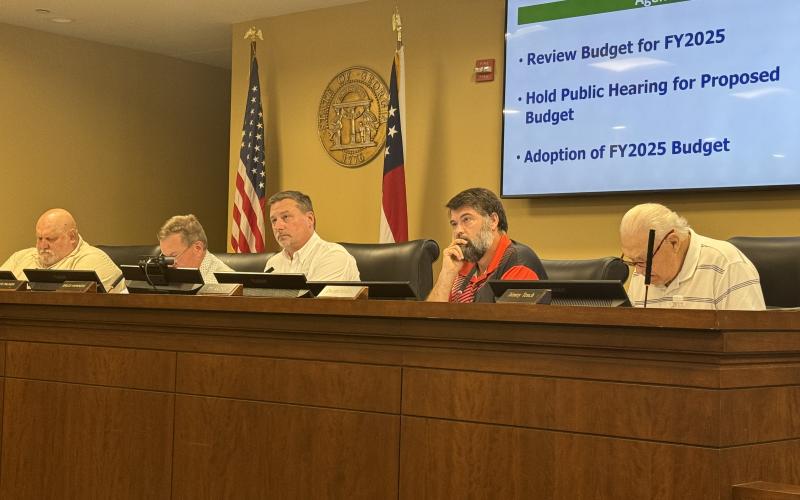 Habersham County Commissioners (from left) Bruce Palmer, Bruce Harkness, Ty Akins, Dustin Mealor and Jimmy Tench try to find common ground Monday night.
