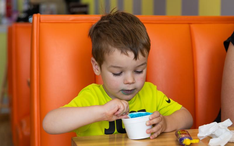 Tommy Howard enjoys his Cookie Monster ice cream at Scoops in Clarkesville. ZACH TAYLOR/Special