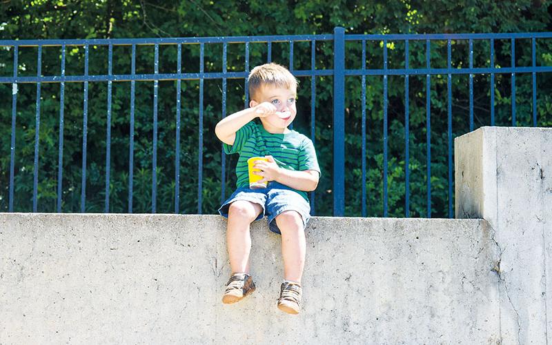 Callan Smith enjoys a snow cone at the Baldwin Mayor’s Reading Club Summer Kickoff on June 7.  Photos by JULIANNE AKERS/Staff