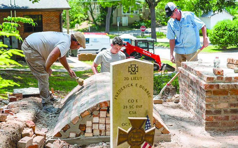 From left: Alton Fry, Danny McDuffie and Mason Tench with Fry Masonry work on restoring the  Durbec family plot at Old Clarkesville Cemetery. JULIANNE AKERS/Staff