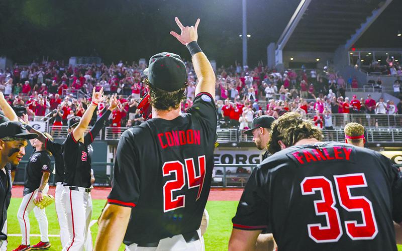 Georgia’s Charlie Condon points to the crowd after Georgia clinched a spot in the NCAA Super Regionals. KARI HODGES/UGAAA