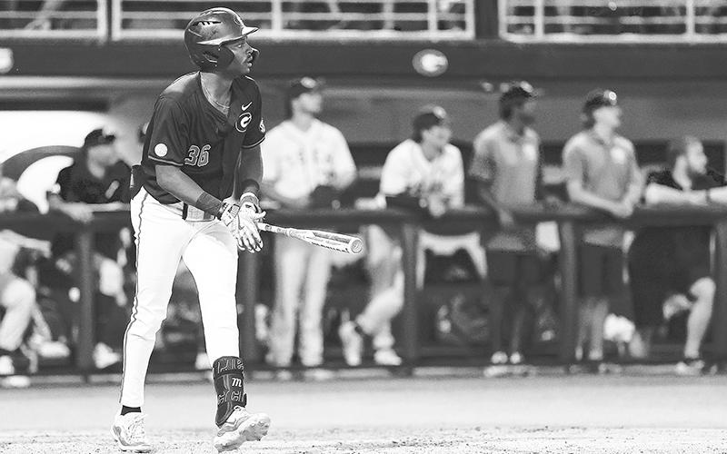 Georgia’s Tre Phelps watches his 8th inning solo home run sail over the wall against Georgia Tech on Sunday night. KARI HODGES/UGAAA