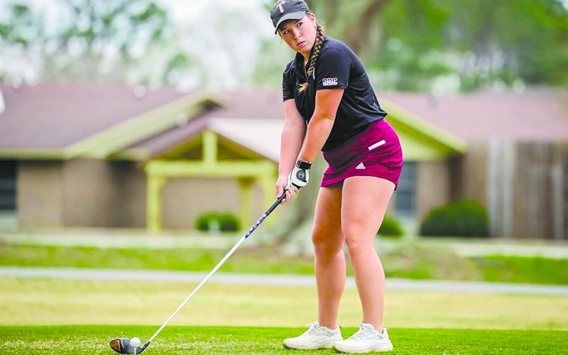 Troy golfer Brinson Hall lines up her drive during a match earlier this year. TROY ATHLETICS/Submitted