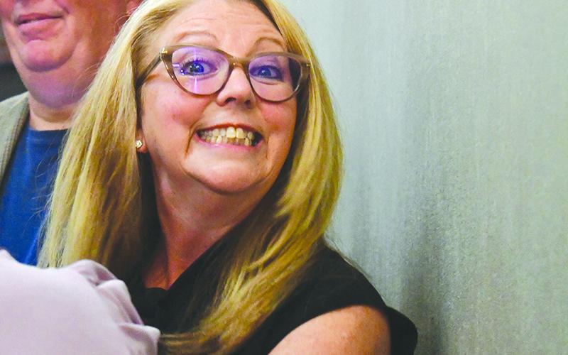 New Board of Education member Darlene Hudson is all smiles after being selected Monday. JULIANNE AKERS/Staff