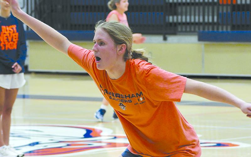 Incoming freshman Tessa Murdock puts pressure on the offense during open gym action this week. LANG STOREY/Staff