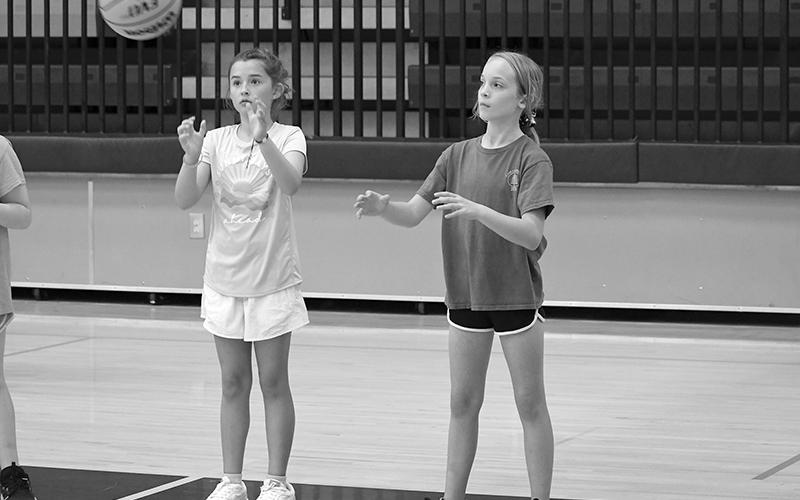 Campers Ruby Nicholson and Ava Allen run a drill at Lady Raider hoops camp earlier this week. The camp runs through the rest of the week, with the boys’ camp beginning next week. LANG STOREY/Staff