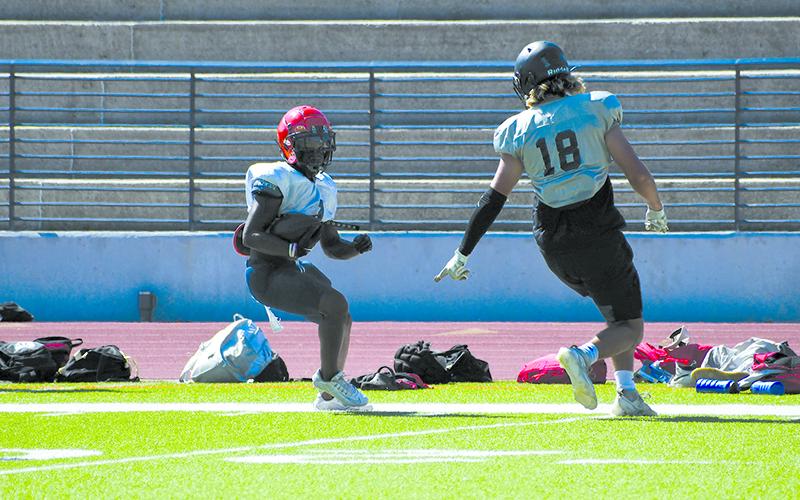 HCHS’ Tylon Davis tries to cut inside a Morgan County defender earlier this week. LANG STOREY/Staff