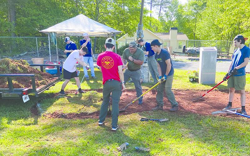 A group of boy scouts plow dirt at the VFW  cemetery to prepare for the installation of Cooper’s flower bed. From left, Trey Humaneus, Brody Allen, Zach Baker and David Quintol lend a hand. SUBMITTED