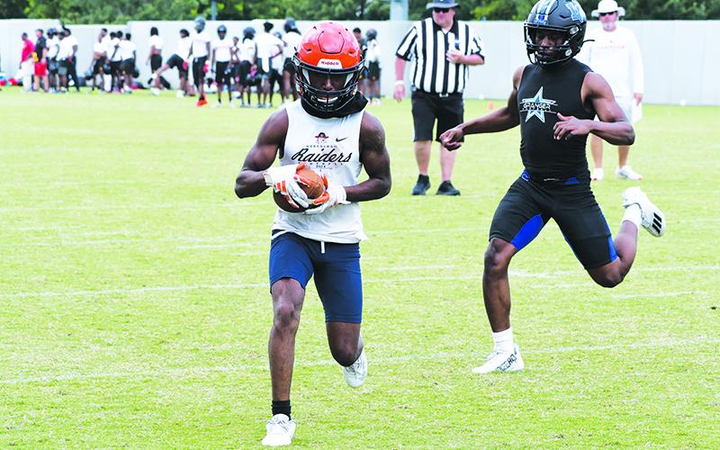 Braydon Strickland takes it into the end zone after hauling in a pass Wednesday. LANG STOREY/Staff