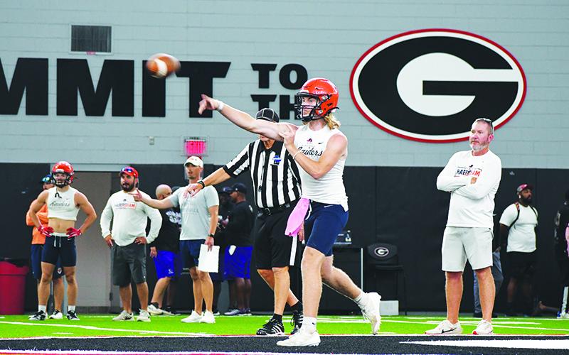 DJ Pass lets it fly during a Wednesday afternoon 7-on-7 game at UGA’s Indoor Athletic Facility. LANG STOREY/Staff