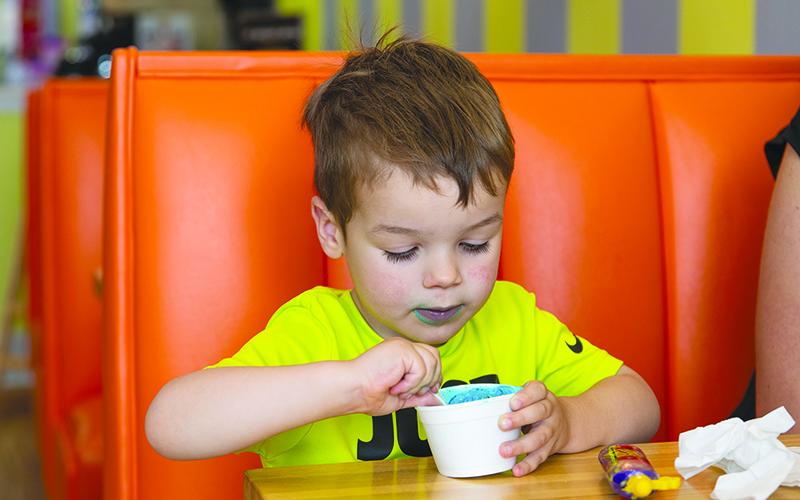 Tommy Howard enjoys his Cookie Monster ice cream at Scoops in Clarkesville. ZACH TAYLOR/Special