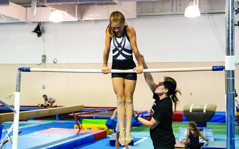 Chloe Baird gets help from Coach Jessica Rockwell. ZACH TAYLOR/Special