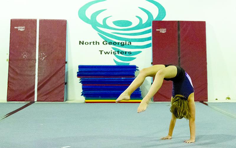 Bella Hunter practices a front walk-over in June. ZACH TAYLOR/Special