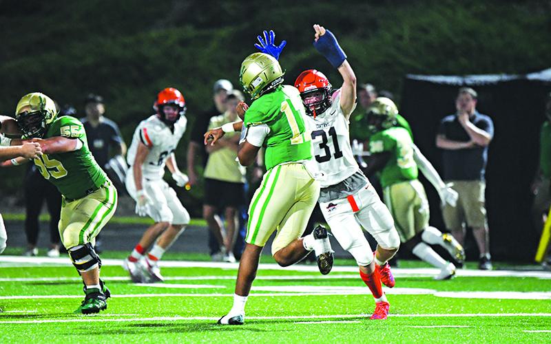 Habersham Central’s Braydon Wright rushes the quarterback against Buford in 2021. FILE