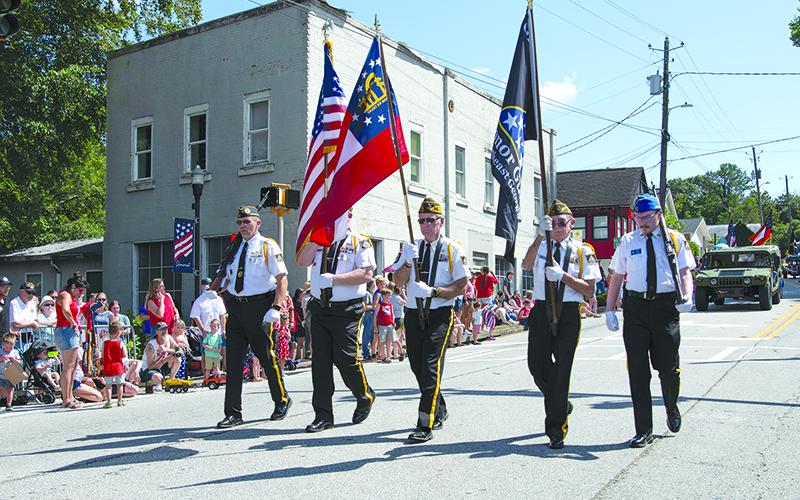 Grant-Reeves Post 7720 Honor Guard Captain Jim Morgan and members Dana McCloud, Rick Chaffin, Bill McAllister and Brady Morgan march in the Color Guard during the Demorest Fourth of July Festival. ZACH TAYLOR/Special