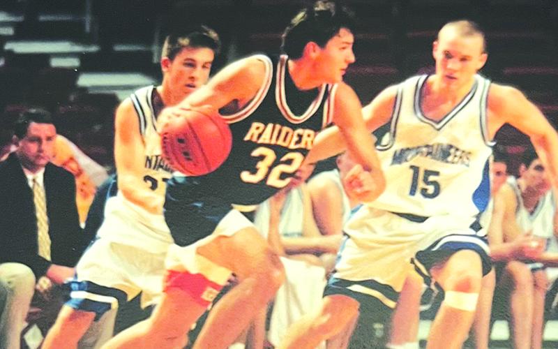 John Lacy drives by a defender at a tournament hosted by the University of Arkansas. FILE