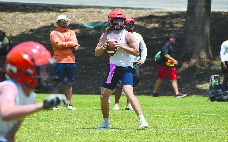 Raiders quarterback DJ Pass looks downfield while a receiver gets into position. LANG STOREY/Staff