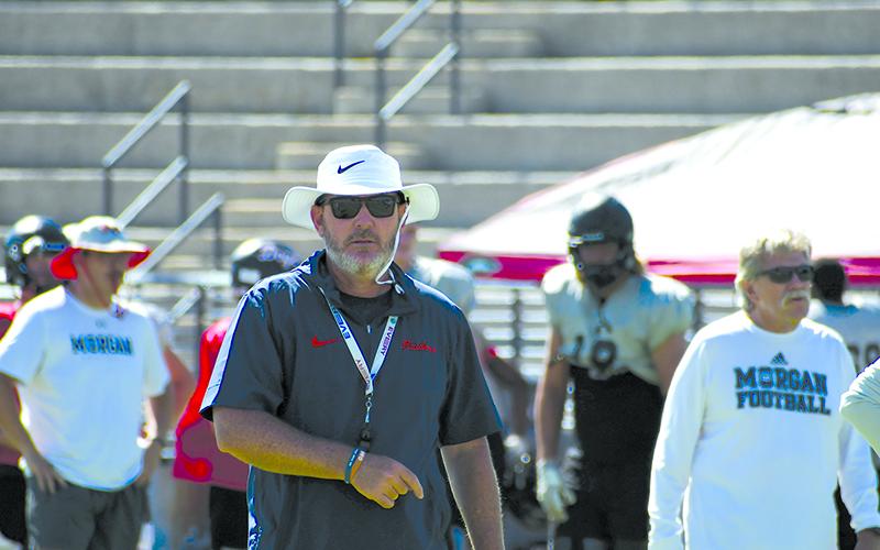 Coach Benji Harrison directs traffic at a previous practice before taking a vacation this week. LANG STOREY/Staff