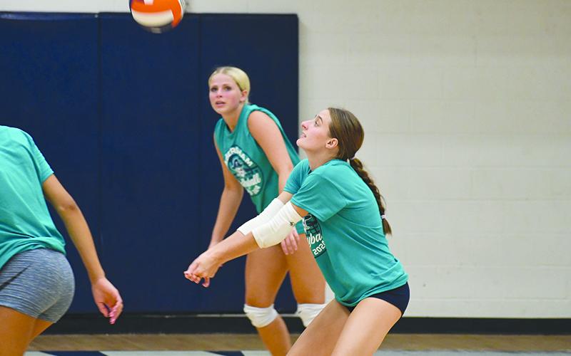 Maci Williams receives a serve during All-American camp. LANG STOREY/Staff