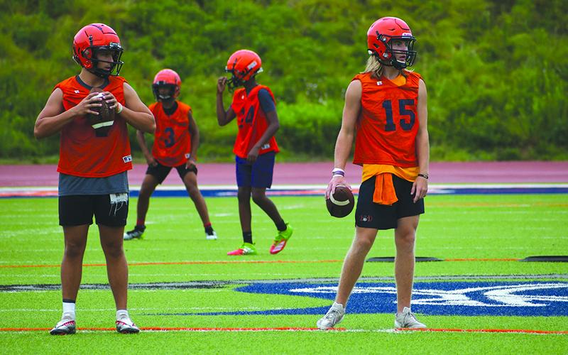 QBs Paris Wilbanks and DJ Pass put in side-by-side reps at practice Thursday. LANG STOREY/Staff