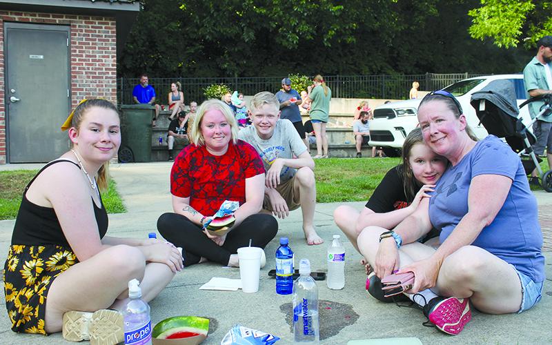 Destiny Weldy, Angel Gaddis, Keegan Gaddis, Aleaha Siebold and Tina Gailey sit in a circle as they enjoy their Saturday in Baldwin. BRIAN WELLMEIER/Special