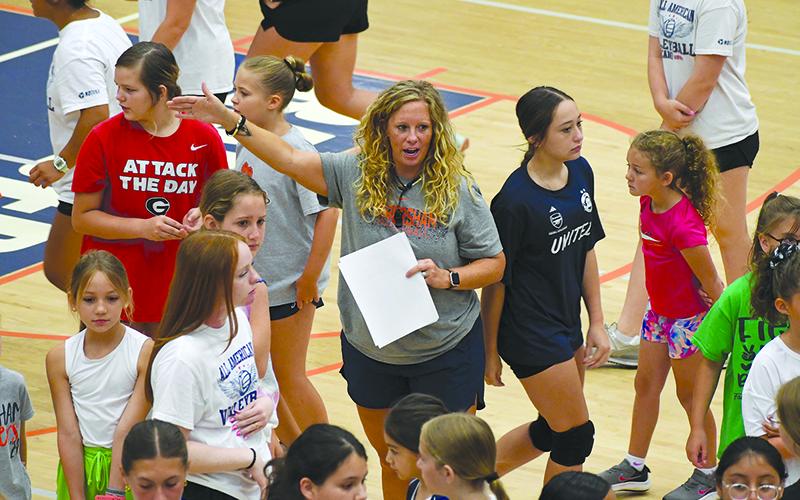 Lady Raiders varsity coach Lindsay Herrin gives instructions at Future Raider Volleyball Camp on Thursday morning. LANG STOREY/Staff