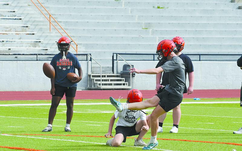 Raider punter/kicker Camden Means works on extra points at practice Wednesday. LANG STOREY/Staff